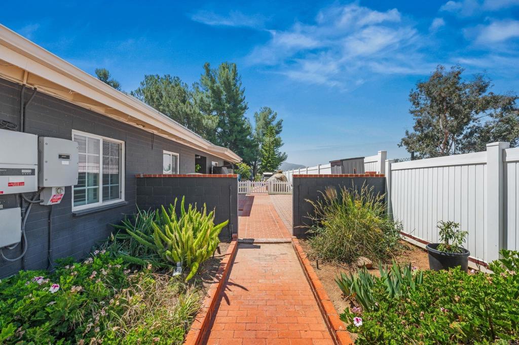 1308 Sundale Road El Cajon, CA 92019 - Photo 49 of 70 a view of a house with a flower garden