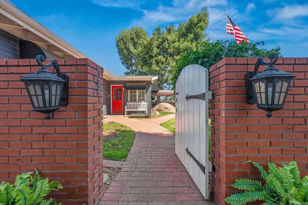 1308 Sundale Road El Cajon, CA 92019 - Photo 5 of 70 a front view of a house with garden