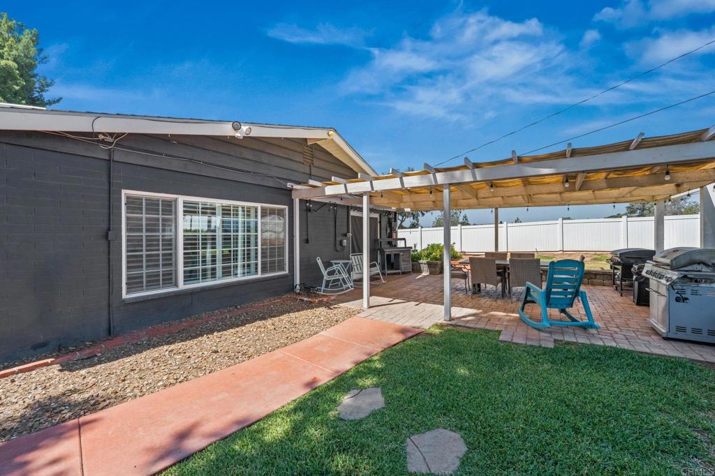 1308 Sundale Road El Cajon, CA 92019 - Photo 52 of 70 a view of a backyard with table and chairs and potted plants