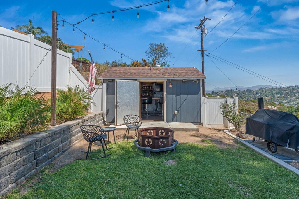 1308 Sundale Road El Cajon, CA 92019 - Photo 53 of 70 a view of a backyard with table and chairs potted plants