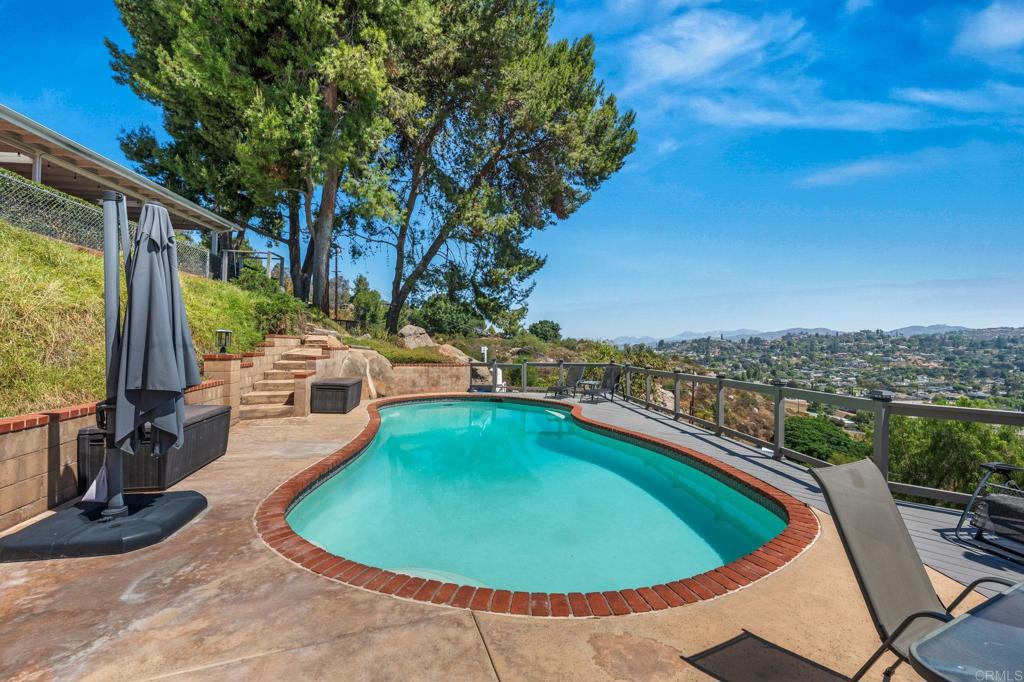 1308 Sundale Road El Cajon, CA 92019 - Photo 8 of 70 a view of a swimming pool with a lounge chairs