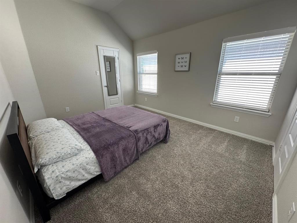1204 Sundrop Drive Little Elm, TX 75068 - Photo 17 of 24 a bedroom with bed and window
