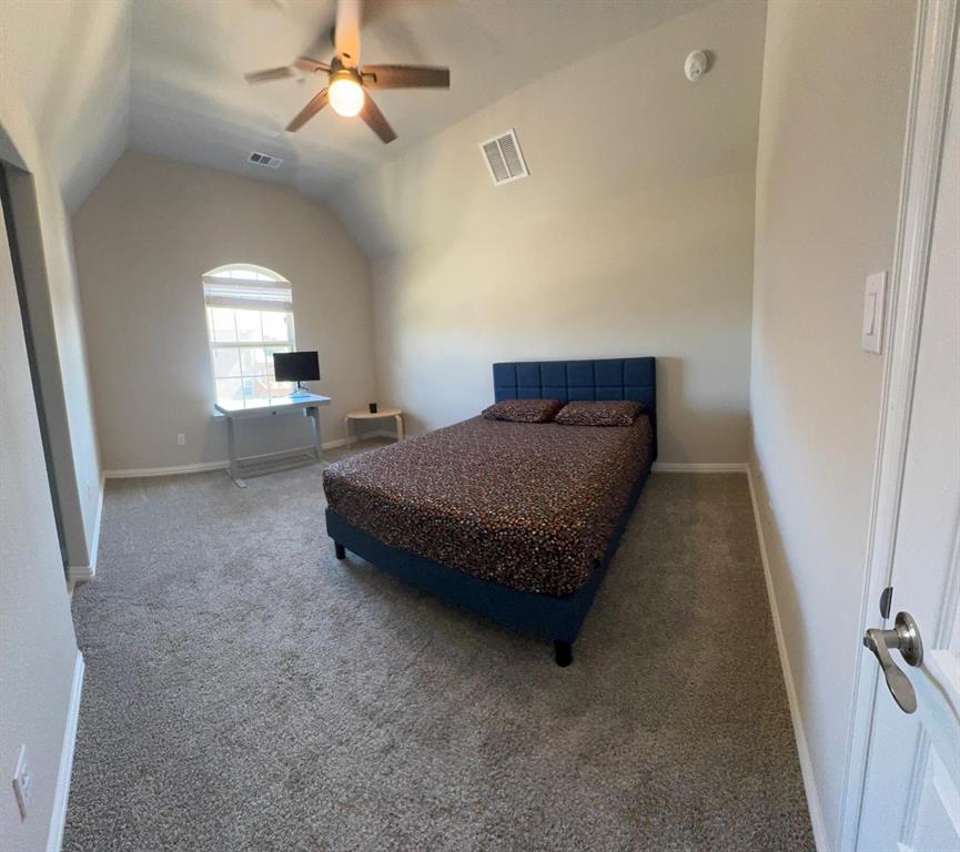 1204 Sundrop Drive Little Elm, TX 75068 - Photo 18 of 24 a bedroom with bed and window