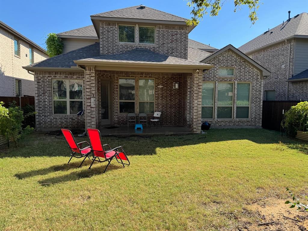 1204 Sundrop Drive Little Elm, TX 75068 - Photo 23 of 24 a view of a house with swimming pool and sitting area