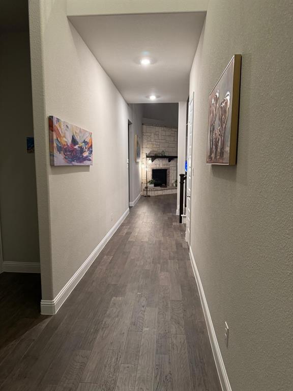 1204 Sundrop Drive Little Elm, TX 75068 - Photo 4 of 24 a view of hallway with furniture and wooden floor