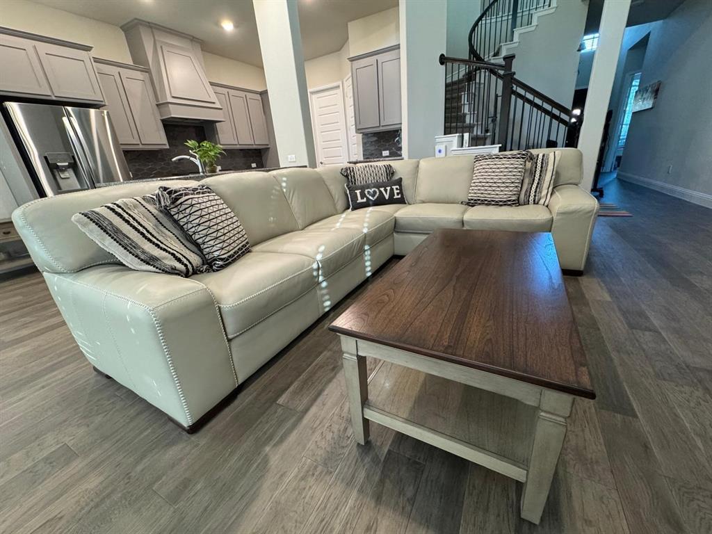 1204 Sundrop Drive Little Elm, TX 75068 - Photo 9 of 24 a living room with furniture and a fireplace