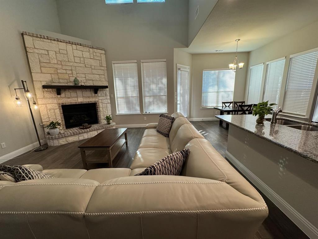 1204 Sundrop Drive Little Elm, TX 75068 - Photo 10 of 24 a living room with furniture and a fireplace