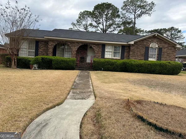 a front view of a house with yard