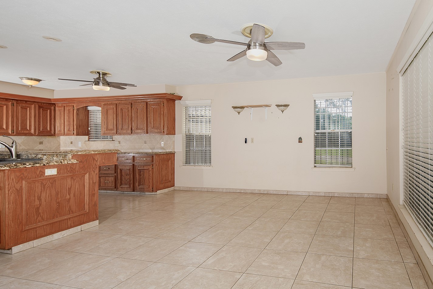 23218 Aldine Westfield Road Spring, TX 77373 - Photo 15 of 47 a view of kitchen with granite countertop cabinets and window