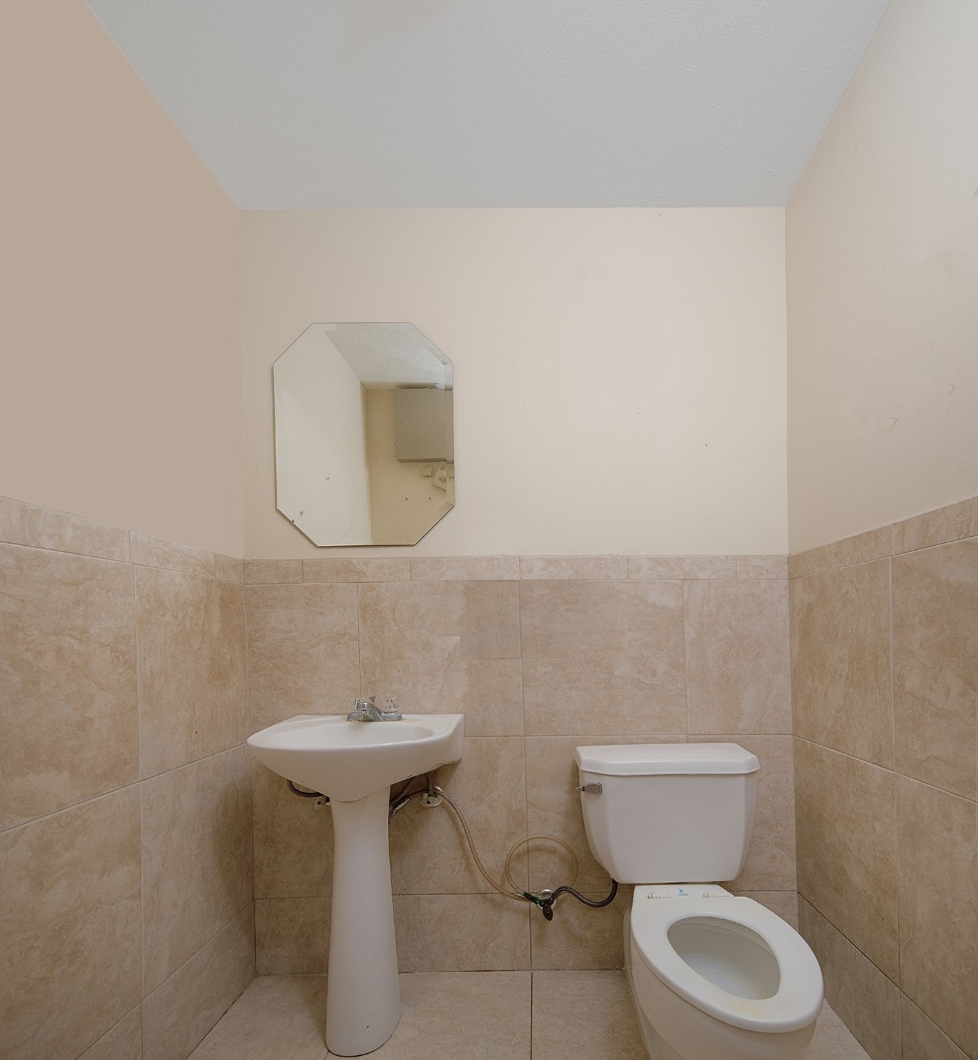 23218 Aldine Westfield Road Spring, TX 77373 - Photo 23 of 47 a bathroom with a toilet sink and mirror