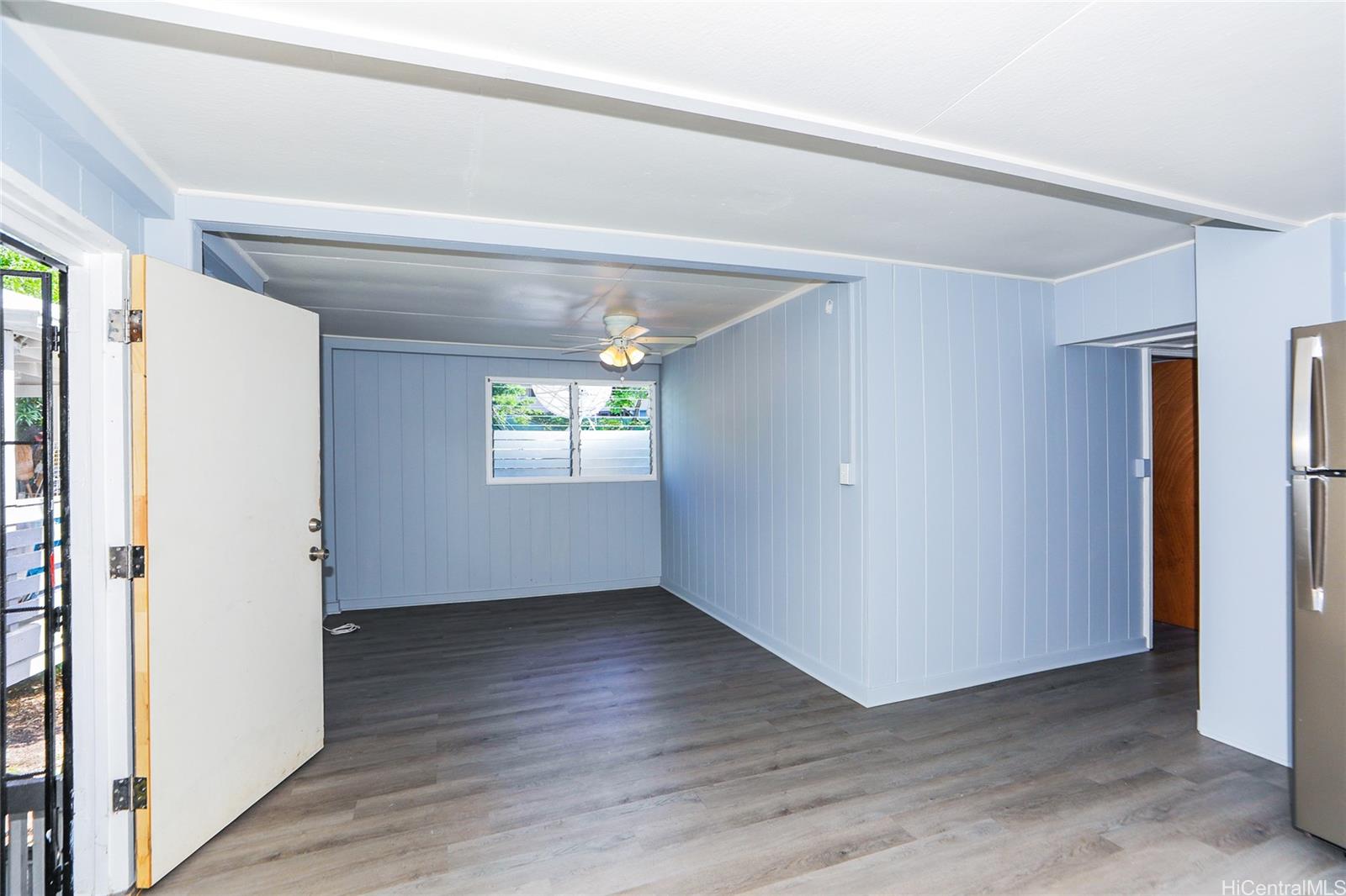 1641 Stillman Lane Honolulu, HI 96817 - Photo 23 of 25 an empty room with wooden floor and windows