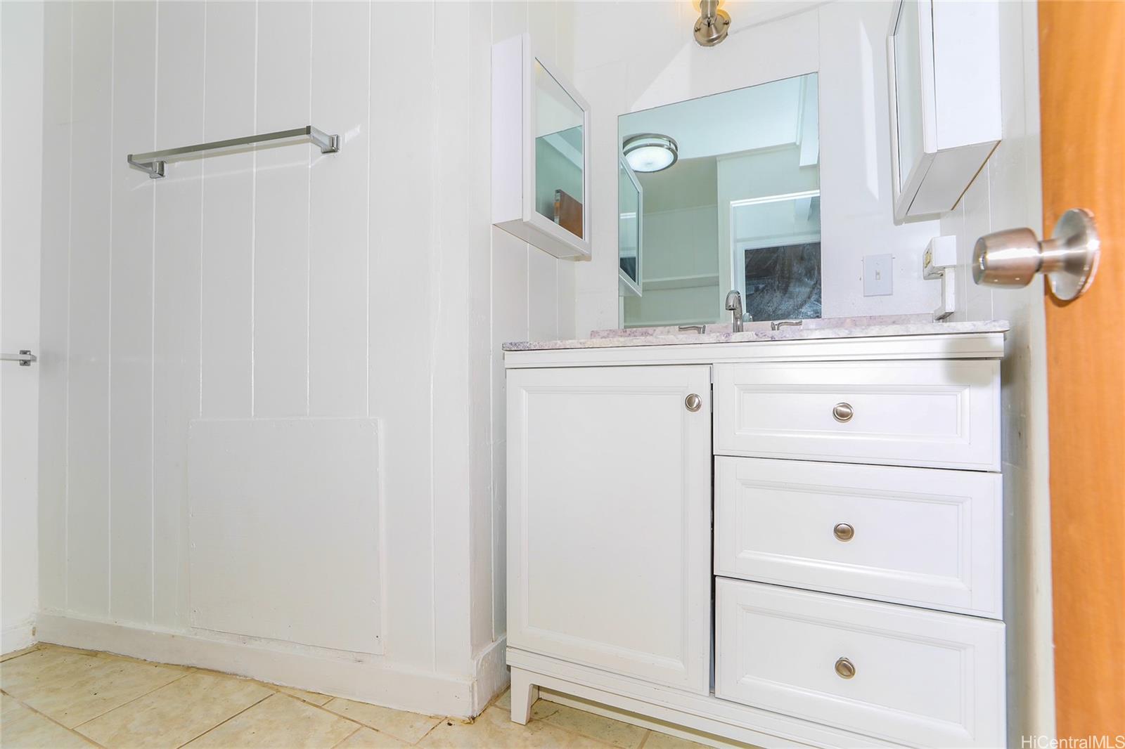 1641 Stillman Lane Honolulu, HI 96817 - Photo 25 of 25 a bathroom with a sink vanity and mirror