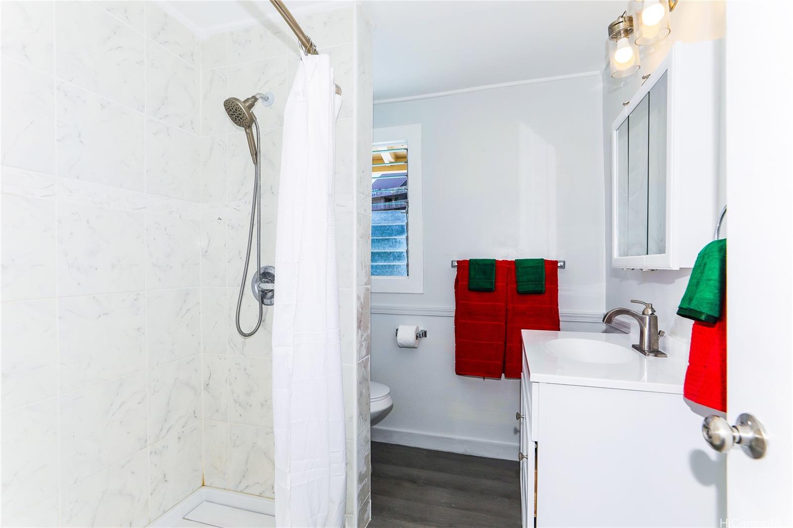 1641 Stillman Lane Honolulu, HI 96817 - Photo 8 of 25 a bathroom with a sink and a shower