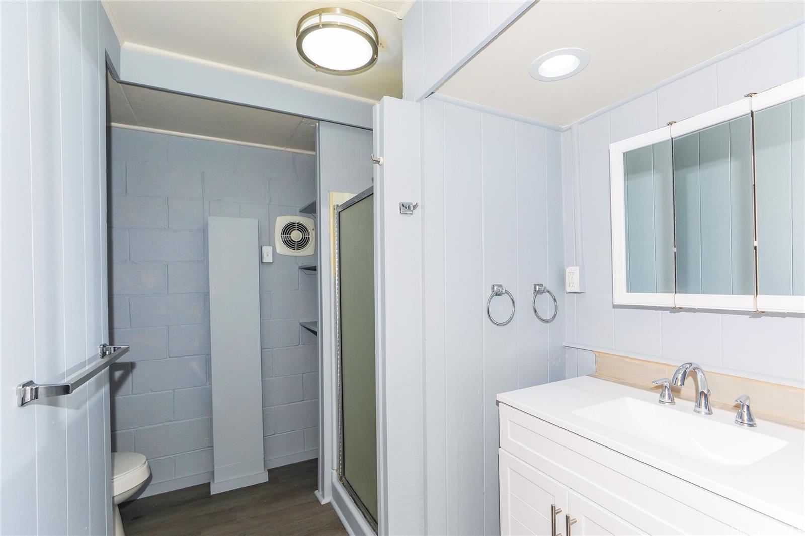 1641 Stillman Lane Honolulu, HI 96817 - Photo 10 of 25 a bathroom with a sink and a mirror