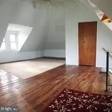 a bathroom with a granite countertop shower a toilet and a sink