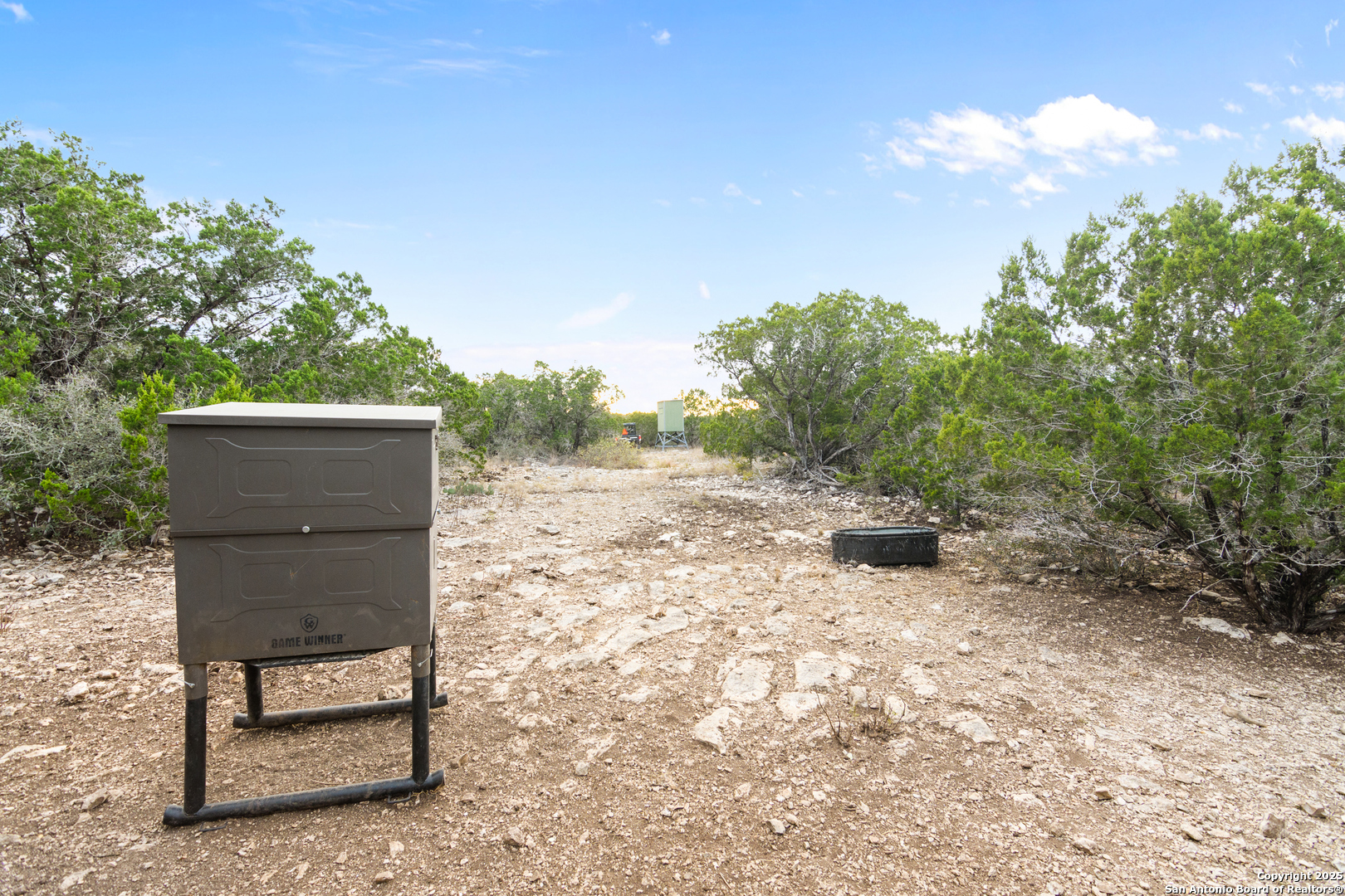 87 Mutt Road Brackettville, TX 78832 - Photo 14 of 20 a backyard of a house with table and chairs