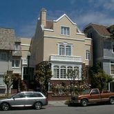 a car parked in front of a houses