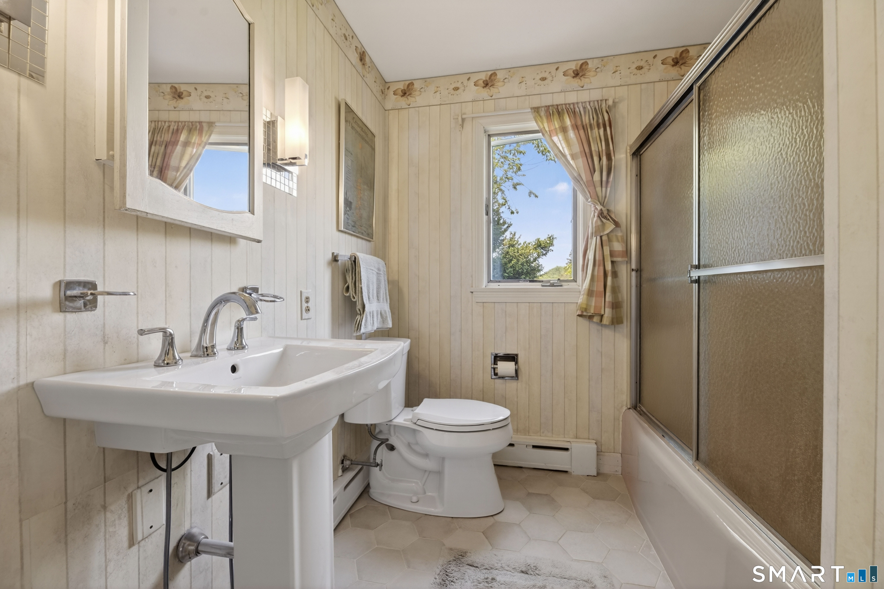 27 Wilbur Road Stonington, CT 06378 - Photo 17 of 40 a bathroom with a sink toilet and shower