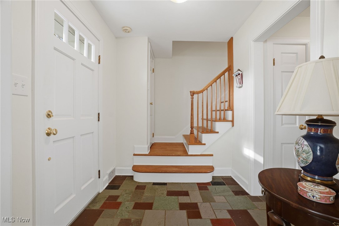 4441 Lake Road West Ashtabula, OH 44004 - Photo 21 of 46 Entryway with stairway and baseboards