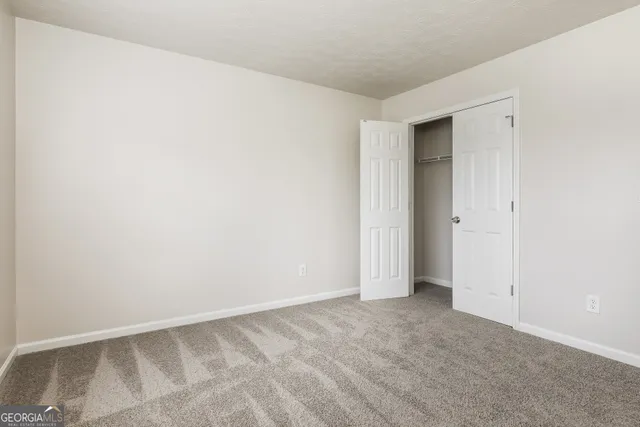 a bathroom with a toilet and a bathtub