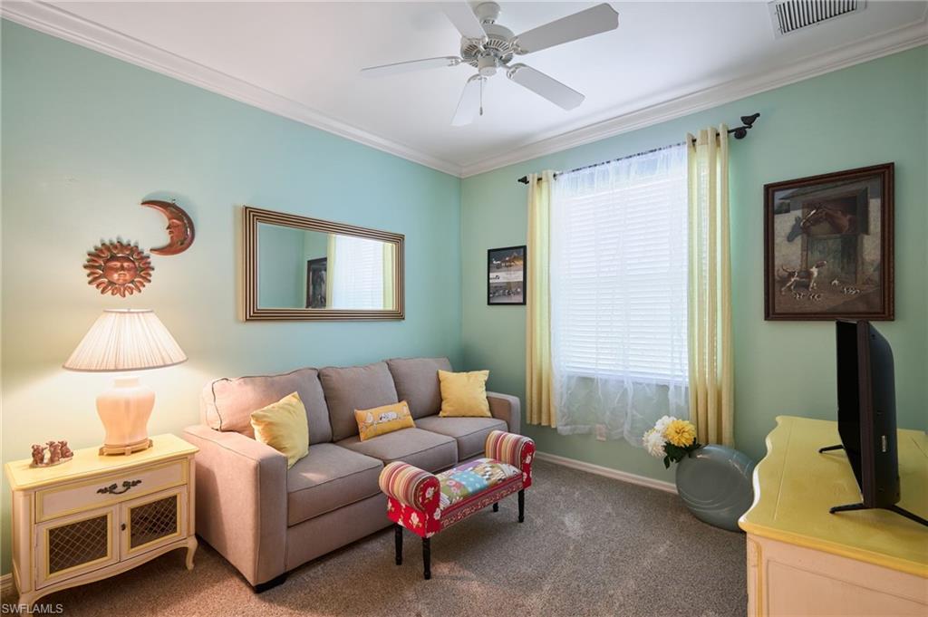 20540 Rookery Drive Estero, FL 33928 - Photo 14 of 32 a bedroom with furniture and a window