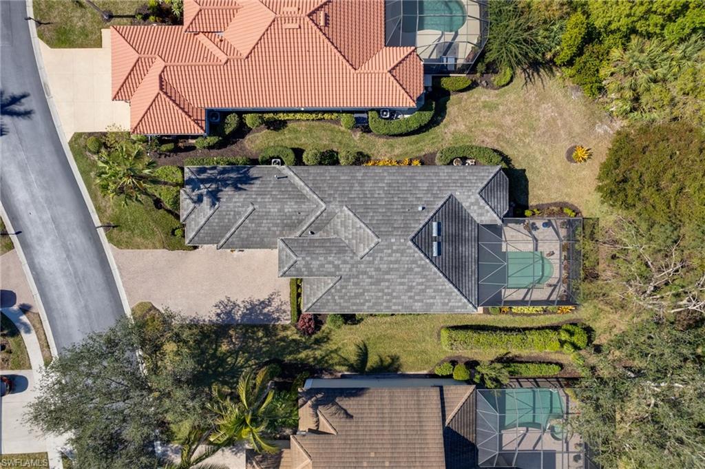 20540 Rookery Drive Estero, FL 33928 - Photo 26 of 32 an aerial view of a house with a garden and a yard