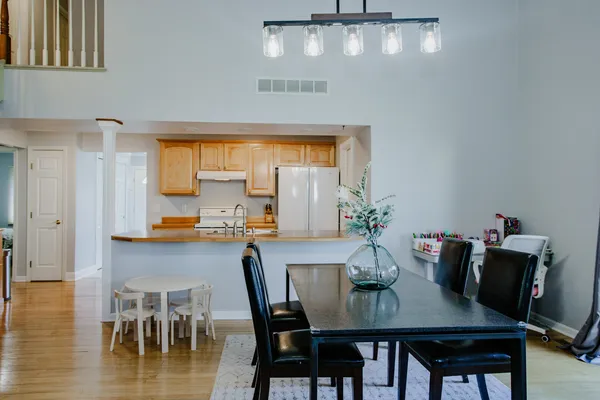 a view of a dining room with furniture and wooden floor