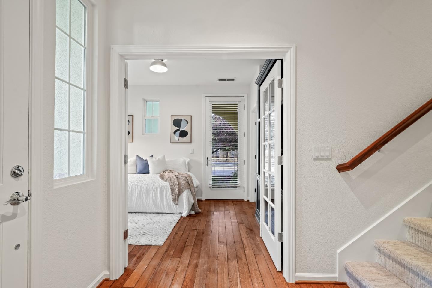 451 Chagall Street Mountain View, CA 94041 - Photo 42 of 58 a view of a hallway with wooden floor and staircase