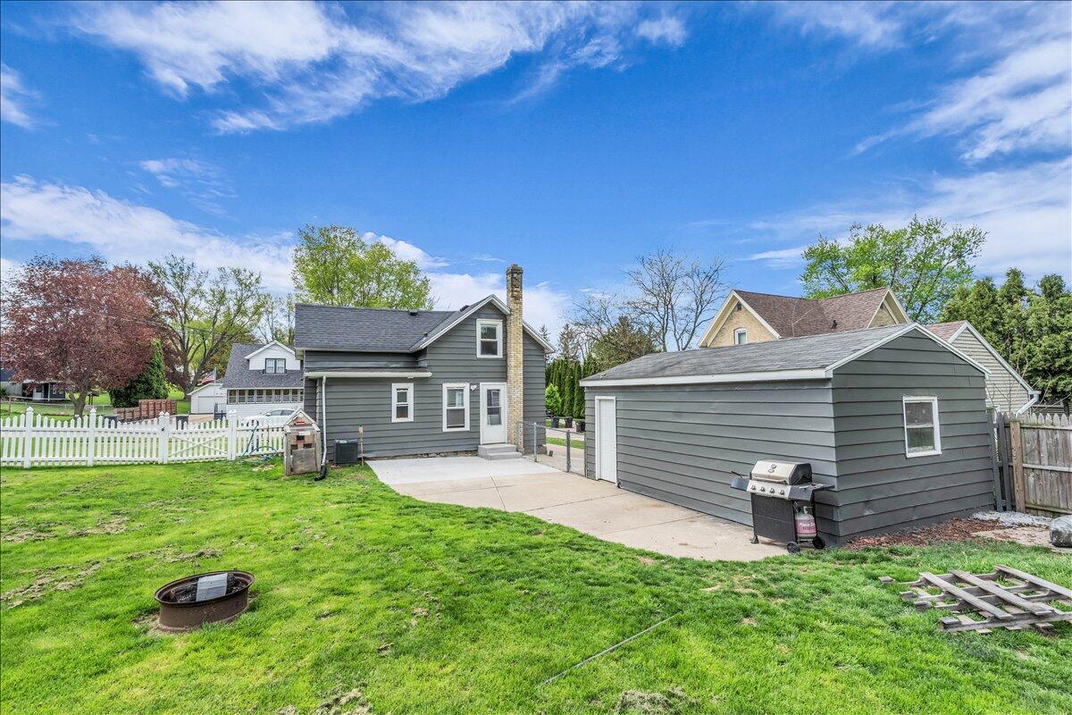 235 East Woolcock Street Jefferson, WI 53549 - Photo 5 of 32 Plenty of space in the fully fenced in backyard for kids, fur babies and/or chickens to roam!