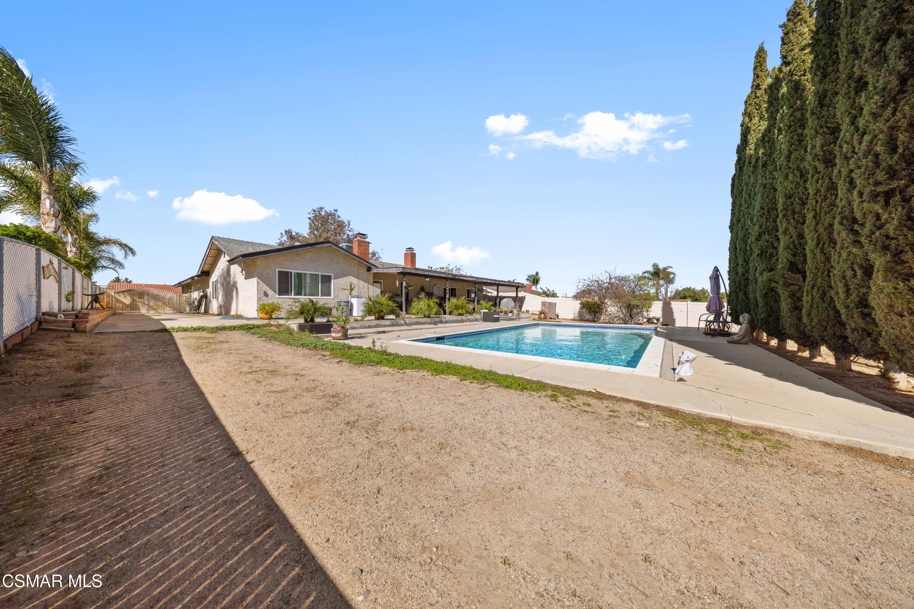 4931 Roundup Road Norco, CA 92860 - Photo 14 of 21 a view of a house with a swimming pool