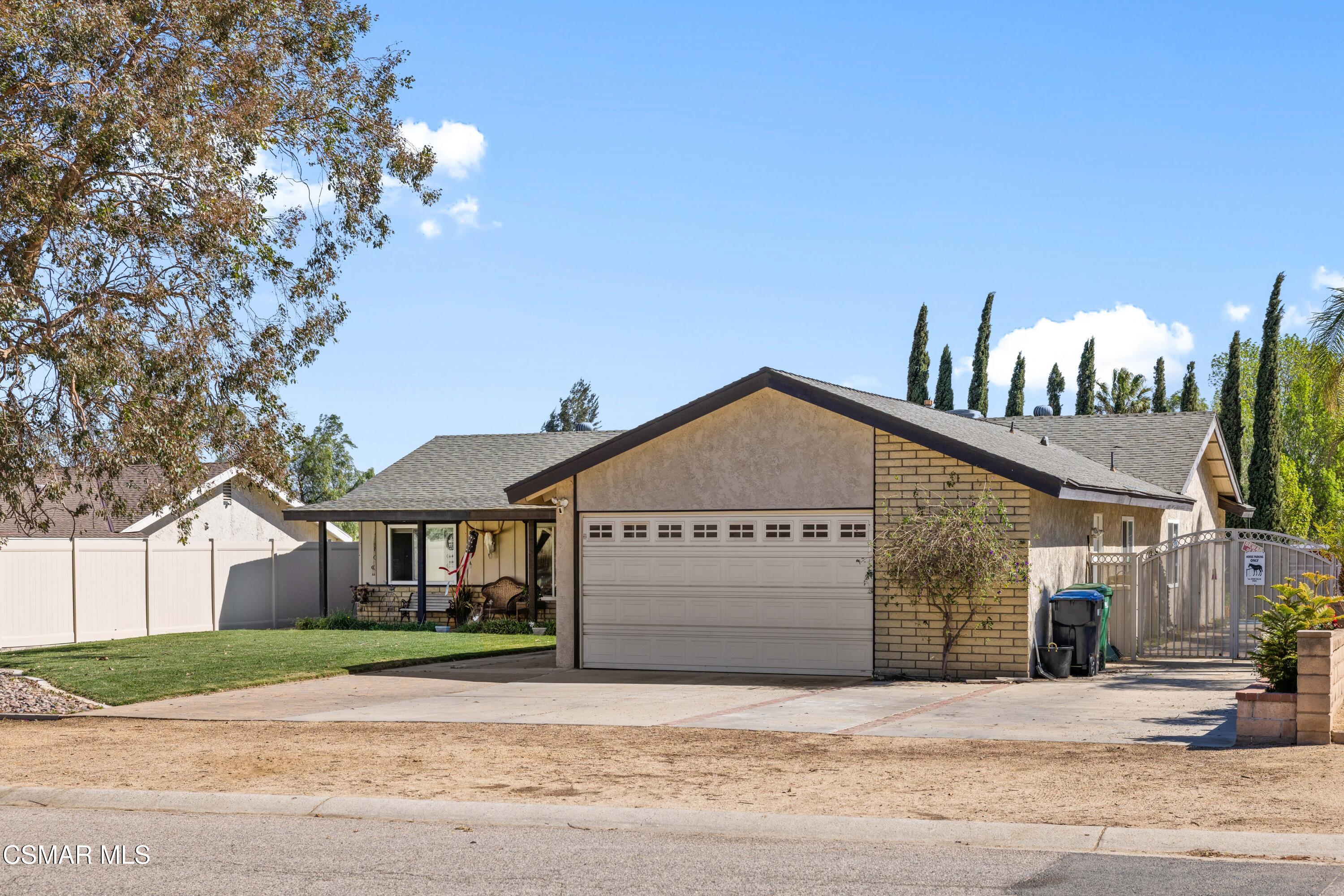 4931 Roundup Road Norco, CA 92860 - Photo 3 of 21 a front view of a house with a yard