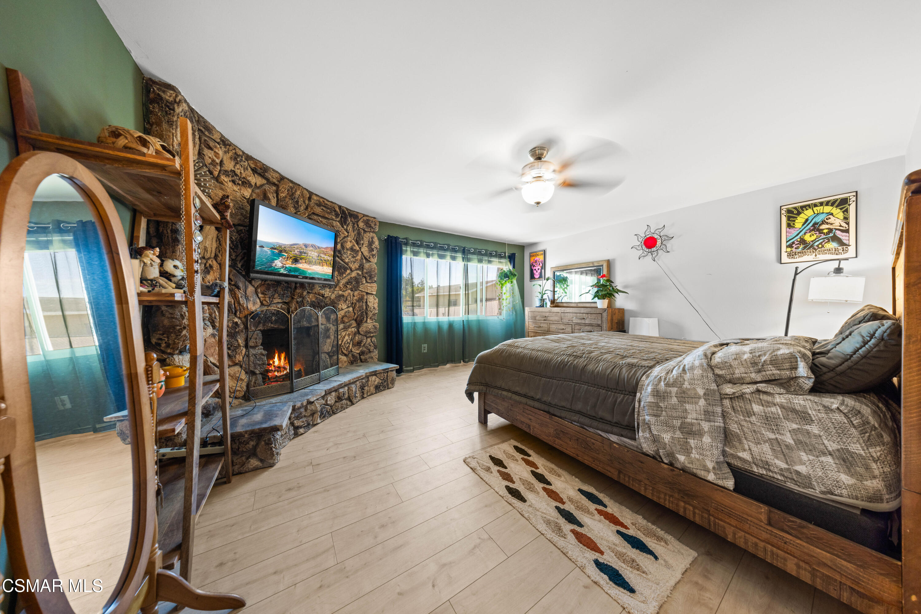 4931 Roundup Road Norco, CA 92860 - Photo 10 of 21 a bedroom with a bed and a flat screen tv