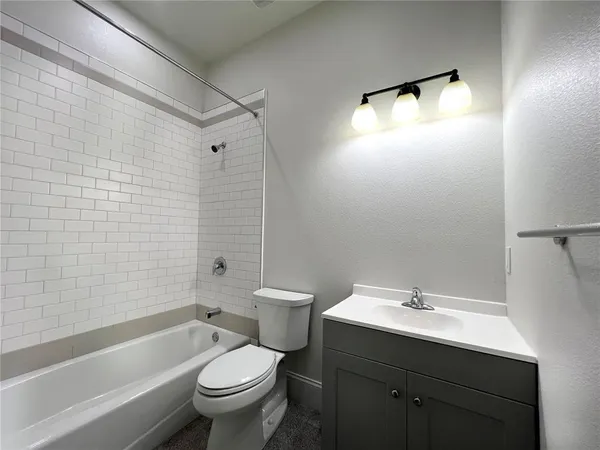 a kitchen with stainless steel appliances wooden cabinets dining table and chairs