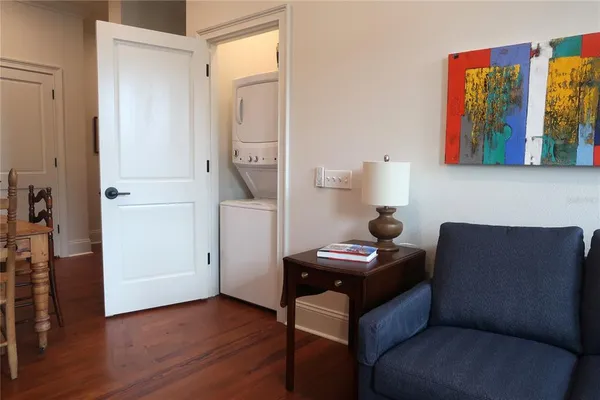 an empty room with closet and a ceiling fan