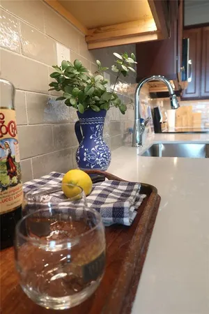 a view of kitchen with sink and wooden floor