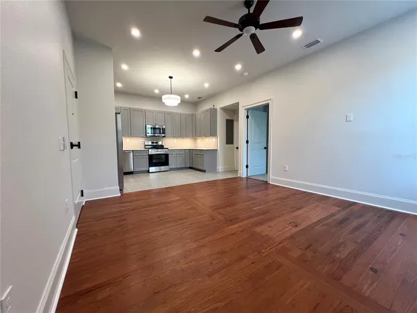 a dinning room with furniture and a chandelier