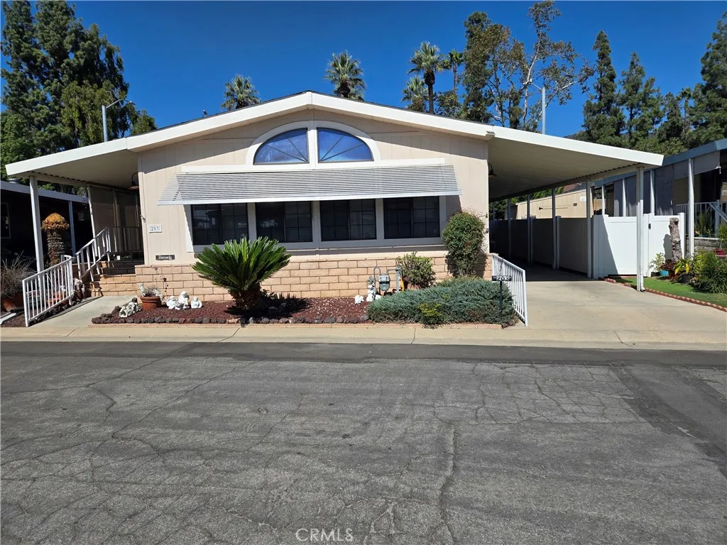 840 Foothill, Unit 203 Azusa, CA 91702 - Photo 4 of 21 a front view of a house with a yard