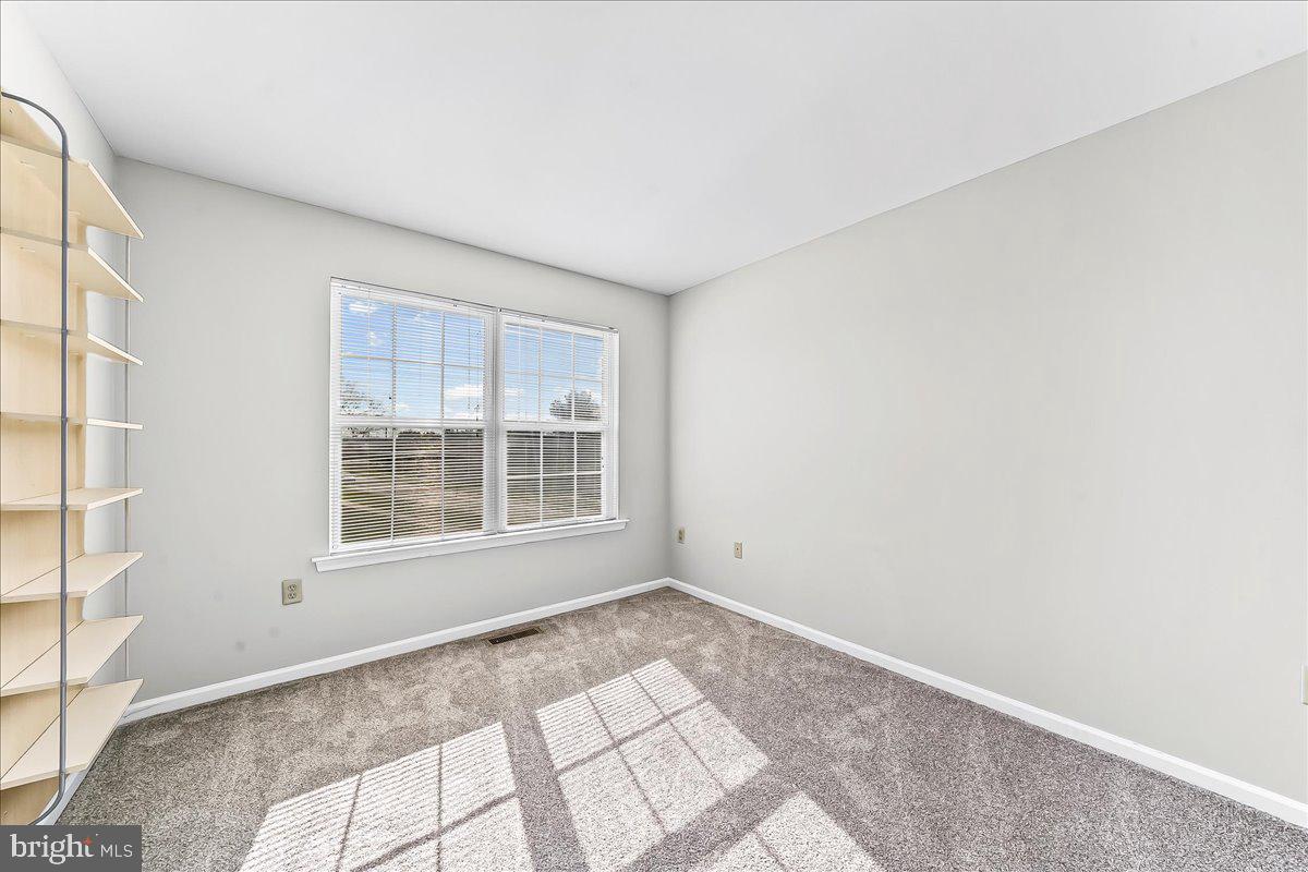 103 Bonnybrook Road Middletown, DE 19709 - Photo 11 of 32 a view of an empty room with a window