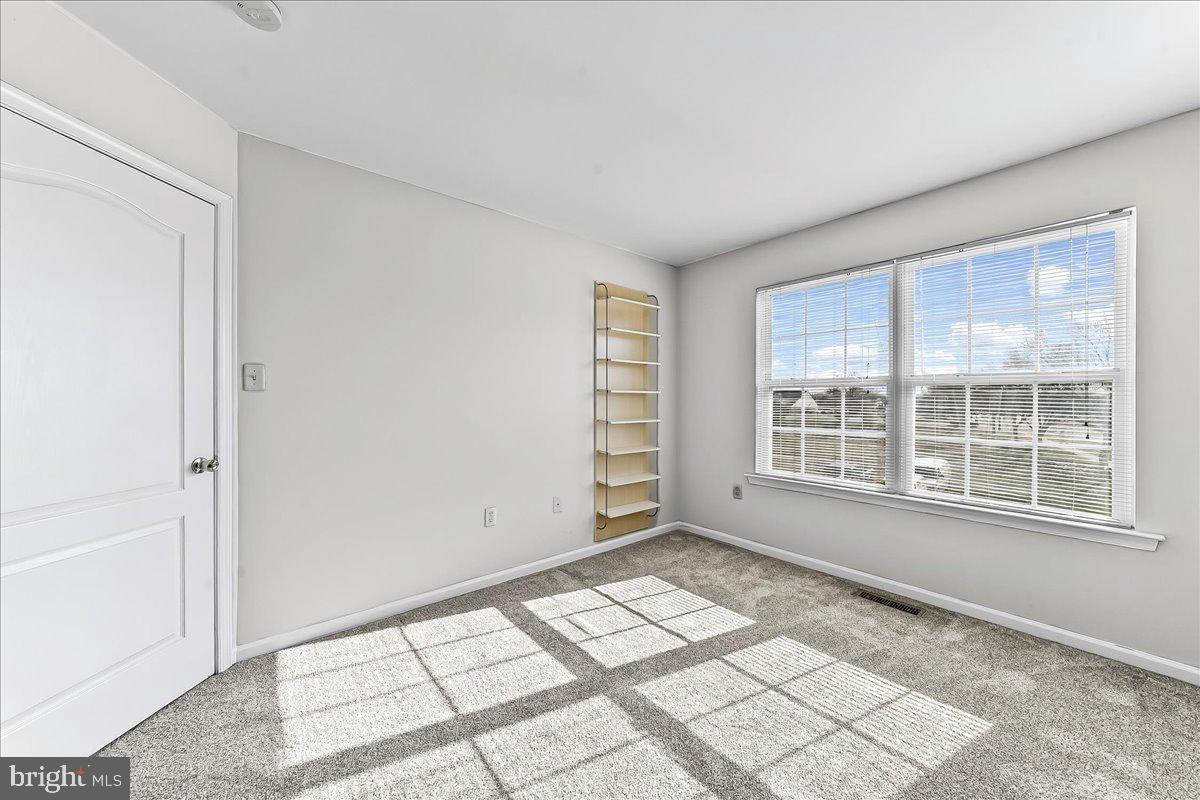 103 Bonnybrook Road Middletown, DE 19709 - Photo 12 of 32 a view of an empty room with a window