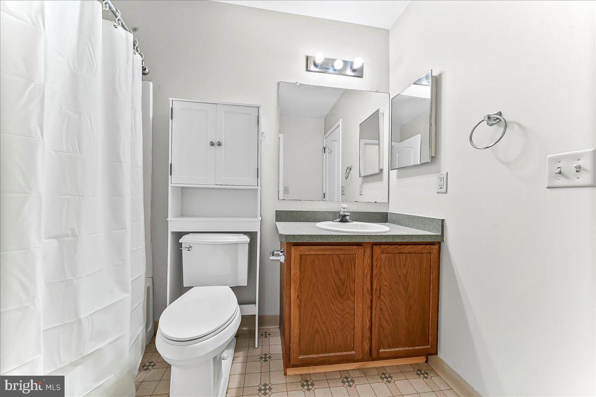 103 Bonnybrook Road Middletown, DE 19709 - Photo 14 of 32 a bathroom with a sink a toilet and shower
