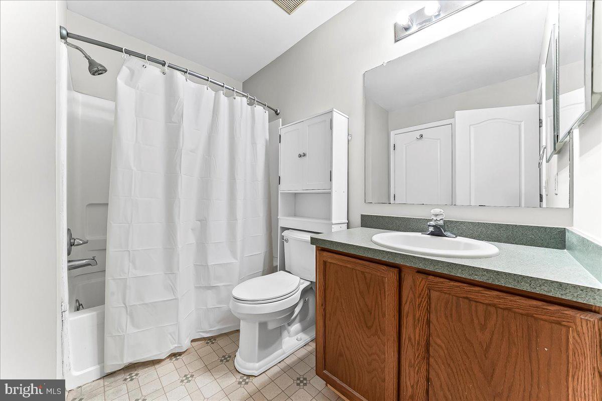 103 Bonnybrook Road Middletown, DE 19709 - Photo 15 of 32 a bathroom with a granite countertop sink and a mirror