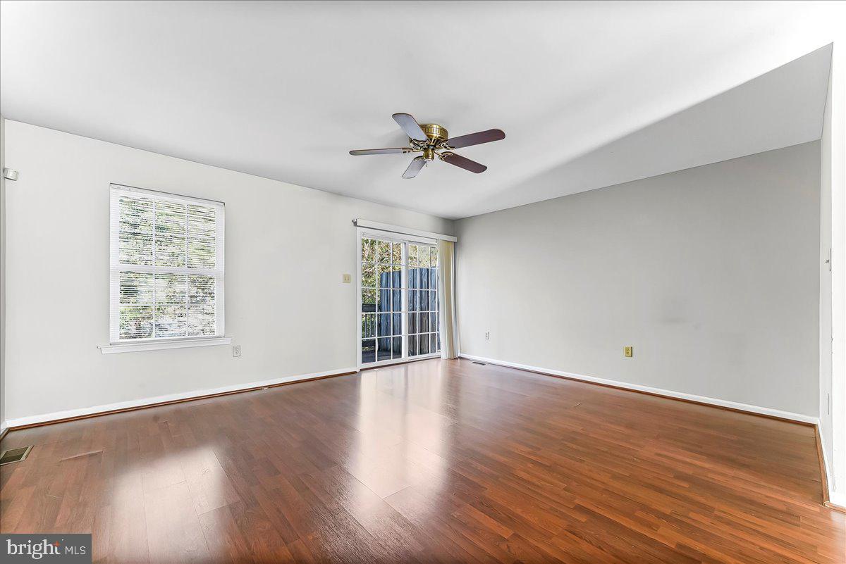 103 Bonnybrook Road Middletown, DE 19709 - Photo 2 of 32 wooden floor in an empty room with a window