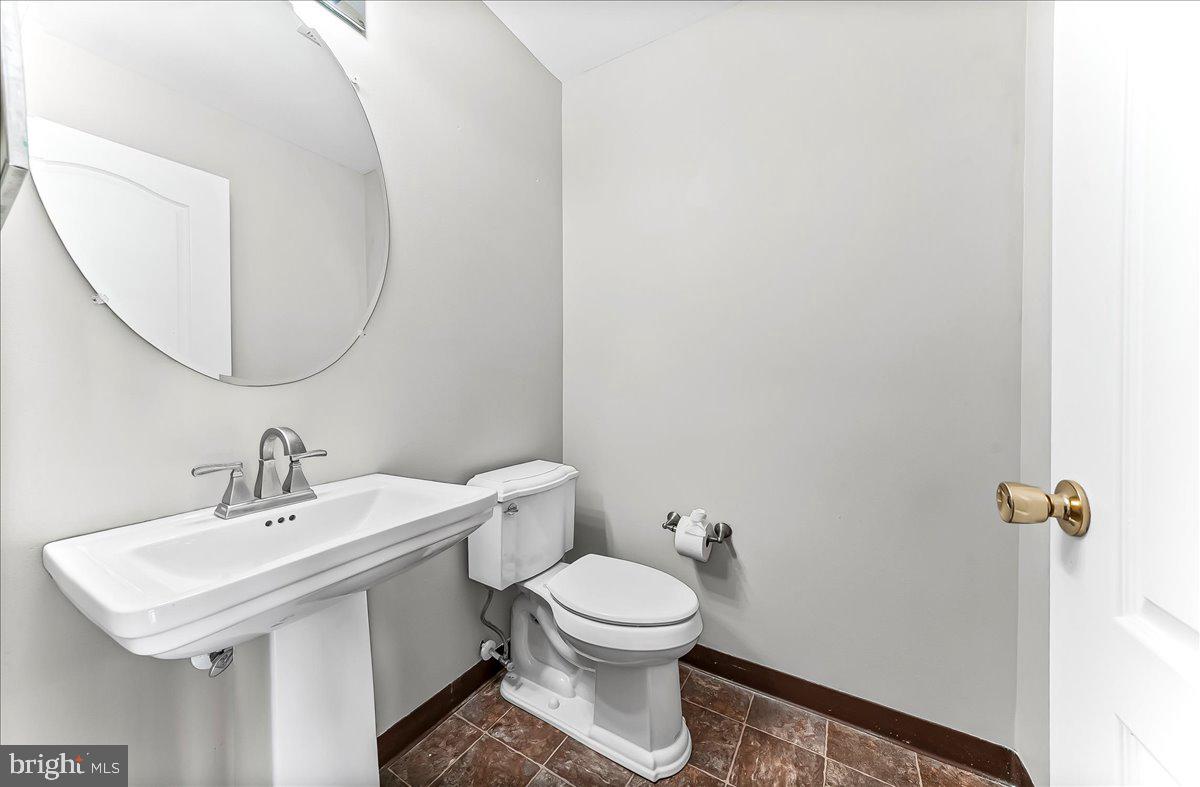 103 Bonnybrook Road Middletown, DE 19709 - Photo 21 of 32 a bathroom with a toilet a sink and a mirror
