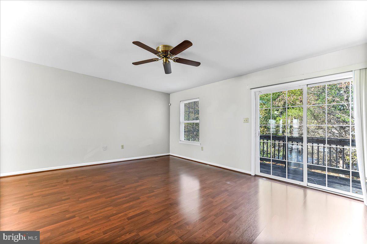 103 Bonnybrook Road Middletown, DE 19709 - Photo 3 of 32 a view of an empty room with wooden floor and a window