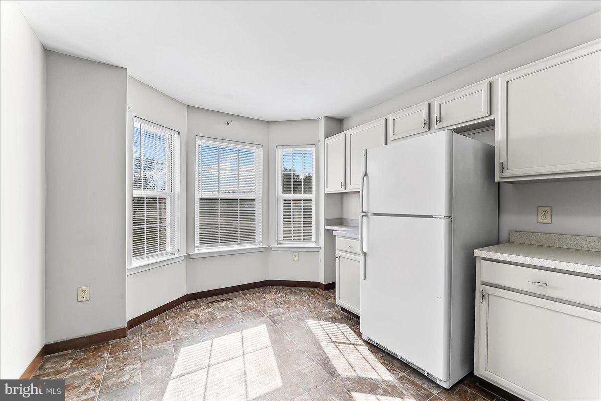 103 Bonnybrook Road Middletown, DE 19709 - Photo 9 of 32 a view of a kitchen with refrigerator and microwave