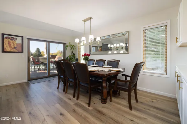 a view of a dining room with furniture window and wooden floor