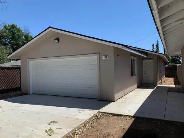 a view of backyard with garage
