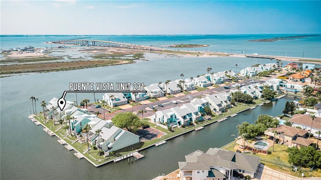 14300 Aloha Street, Unit 231 Corpus Christi, TX 78418 - Photo 1 of 37 an aerial view of ocean and residential houses with outdoor space