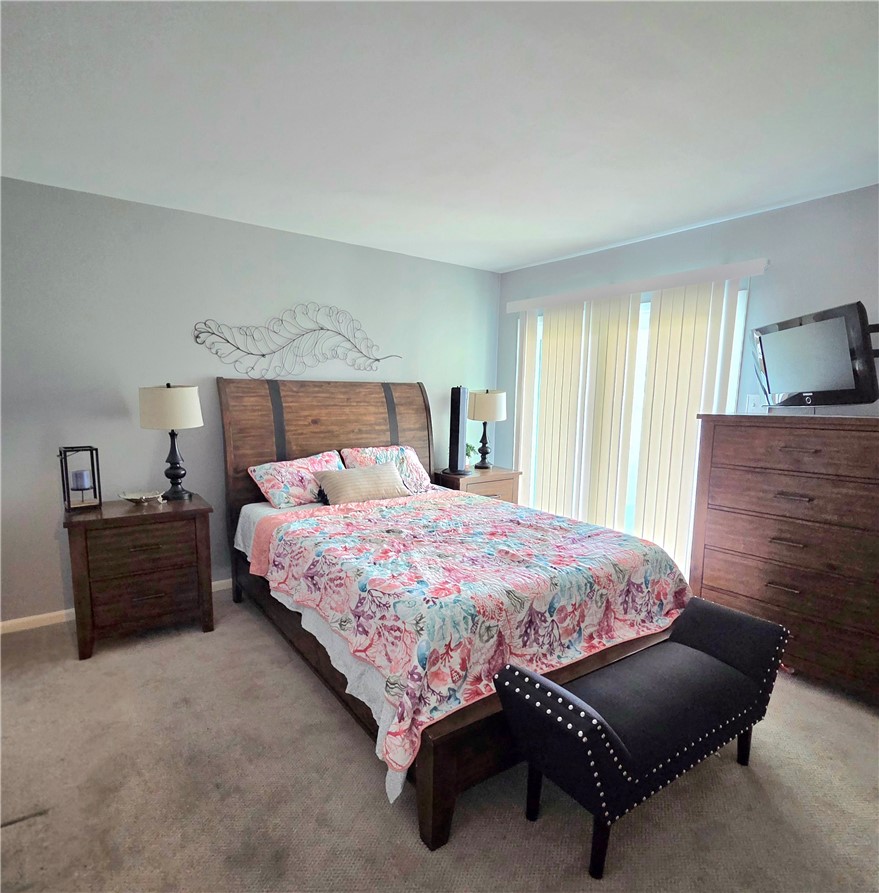 14300 Aloha Street, Unit 231 Corpus Christi, TX 78418 - Photo 13 of 37 a bedroom with a bed and window