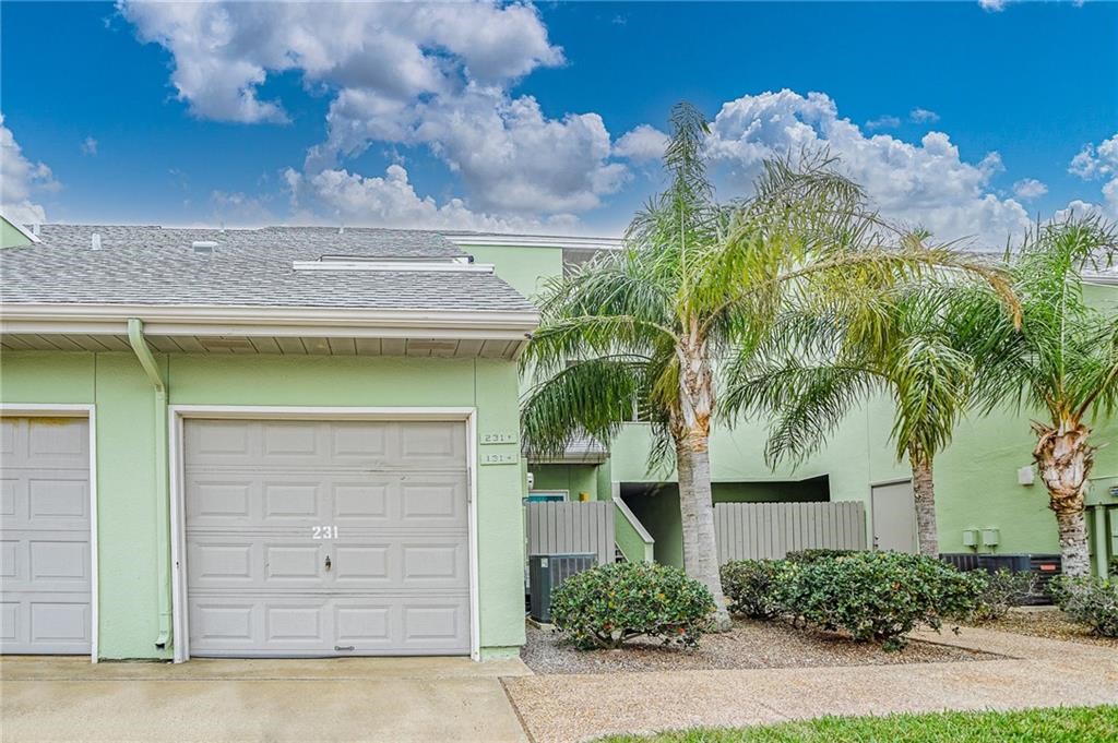 14300 Aloha Street, Unit 231 Corpus Christi, TX 78418 - Photo 3 of 37 front view of a house with a garage